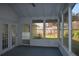Bright sunroom with multiple windows, door and outdoor views, creating a relaxing space at 345 Forest Valley Rd, Lawrenceville, GA 30046