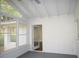 Bright sunroom featuring large windows and a doorway leading to other areas of the home at 345 Forest Valley Rd, Lawrenceville, GA 30046
