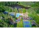Community amenities include tennis courts, pool, clubhouse, parking and pond, all enveloped in a natural setting at 3741 Windhurst Dr, Lilburn, GA 30047