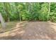 Wooded backyard with large trees and shade provides privacy and a peaceful outdoor setting at 3741 Windhurst Dr, Lilburn, GA 30047