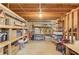 Spacious basement with exposed beams, shelving, and ample storage capacity for organization at 3741 Windhurst Dr, Lilburn, GA 30047