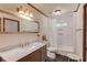 Bathroom featuring sleek vanity, stylish backsplash, and a shower-tub combo with subway tile surround at 3741 Windhurst Dr, Lilburn, GA 30047