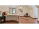 Spacious bedroom featuring natural light, laminate wood flooring, and charming decor at 3741 Windhurst Dr, Lilburn, GA 30047