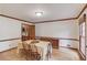 Dining room featuring hardwood floors and neutral decor, ideal for formal gatherings at 3741 Windhurst Dr, Lilburn, GA 30047