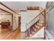Bright foyer with hardwood floors and staircase, welcoming guests into the home at 3741 Windhurst Dr, Lilburn, GA 30047
