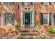 Close up of the front door, with columns and dark shutters at 3741 Windhurst Dr, Lilburn, GA 30047