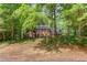 Traditional brick home with a mature treed front yard offering curb appeal and charm at 3741 Windhurst Dr, Lilburn, GA 30047