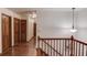 Hallway with multiple wood doors and wood floors at 3741 Windhurst Dr, Lilburn, GA 30047