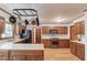 A traditional kitchen boasts wood floors, shaker cabinets, a pot rack and stainless steel appliances at 3741 Windhurst Dr, Lilburn, GA 30047
