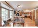 Kitchen and dining area with wood floors, light countertops, stainless appliances, and lots of natural light at 3741 Windhurst Dr, Lilburn, GA 30047