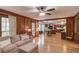 An open-concept room features hardwood floors, a living room, a dining area, and a modern kitchen at 3741 Windhurst Dr, Lilburn, GA 30047