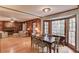 An open-concept design shows a living room and a dining space with large windows for light at 3741 Windhurst Dr, Lilburn, GA 30047