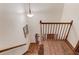 Staircase with wood treads and decorative wood railing leading down to the foyer at 3741 Windhurst Dr, Lilburn, GA 30047