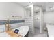 A bathroom with bathtub, tile shower and a double sink with white countertops at 4131 West Village Pkwy, Ellenwood, GA 30294