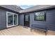 Relaxing deck area featuring a sliding glass door and comfortable seating at 4131 West Village Pkwy, Ellenwood, GA 30294