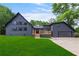 Charming gray two-story home with a well-manicured lawn and inviting deck at 4131 West Village Pkwy, Ellenwood, GA 30294