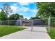Charming gray home featuring a well-maintained lawn and secure fencing at 4131 West Village Pkwy, Ellenwood, GA 30294