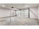 Garage with overhead door and concrete floor, ready for parking or storage at 4131 West Village Pkwy, Ellenwood, GA 30294