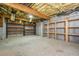 Unfinished basement with exposed ceiling, shelving and concrete flooring perfect for storage at 7240 Highbrook Cir, Cumming, GA 30041