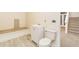 Small and cozy bathroom, a new vanity, toilet and vinyl flooring adjacent to the stairs at 7240 Highbrook Cir, Cumming, GA 30041