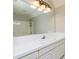 Bright bathroom featuring a large mirror, single vanity, and a shower at 7240 Highbrook Cir, Cumming, GA 30041