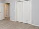 Bright bedroom with closet and neutral colored carpet at 7240 Highbrook Cir, Cumming, GA 30041