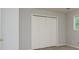Neutral bedroom with closet and a view to the exterior at 7240 Highbrook Cir, Cumming, GA 30041
