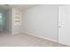 Neutral bedroom featuring carpeted flooring, built-in shelving, and a single door at 7240 Highbrook Cir, Cumming, GA 30041