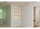 Bedroom featuring neutral walls, carpeted flooring, and built-in shelving at 7240 Highbrook Cir, Cumming, GA 30041