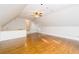 Large bonus room with vaulted ceilings, recessed lights, beautiful hardwood floors and wet bar at 7240 Highbrook Cir, Cumming, GA 30041