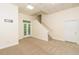 Finished carpeted bonus room with exterior access, recessed lighting, and convenient access to stairs at 7240 Highbrook Cir, Cumming, GA 30041