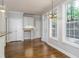 Light-filled dining area with hardwood floors, large windows, and access to the outside at 7240 Highbrook Cir, Cumming, GA 30041