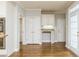 Spacious dining area features hardwood floors, white trim, and built-in cabinets at 7240 Highbrook Cir, Cumming, GA 30041