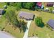 Aerial view of home with large lot and mature trees surrounded by neighborhood at 10116 Straphinge Trl, Covington, GA 30014