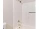 Bathroom featuring shower with chrome hardware, and adjacent toilet at 10116 Straphinge Trl, Covington, GA 30014