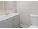 Clean and updated bathroom with modern vanity, sink and toilet at 10116 Straphinge Trl, Covington, GA 30014