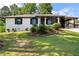 Charming brick home with a well-manicured lawn and tasteful landscaping at 10116 Straphinge Trl, Covington, GA 30014