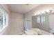 Bright bathroom with vanity, mirror, updated fixtures, and shower-tub combination at 3512 Valley Chase Ct, Lithonia, GA 30038