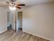 Bright bedroom featuring a ceiling fan, closet, and neutral walls at 3512 Valley Chase Ct, Lithonia, GA 30038