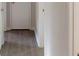 Hallway with light wood-look flooring, neutral walls, and white trim at 3512 Valley Chase Ct, Lithonia, GA 30038