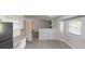 Spacious kitchen boasts light countertops, a dining space, modern appliances, and hardwood flooring at 3512 Valley Chase Ct, Lithonia, GA 30038