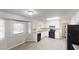 Well-lit kitchen featuring white cabinetry, modern appliances, and a window for natural light at 3512 Valley Chase Ct, Lithonia, GA 30038
