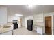 Bright kitchen featuring white cabinets, modern black appliances, and light colored counter tops at 3512 Valley Chase Ct, Lithonia, GA 30038