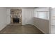 Spacious living room featuring a stone fireplace, light wood floors, and ample natural light at 3512 Valley Chase Ct, Lithonia, GA 30038