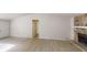 Spacious living room featuring a stone fireplace and light wood-look flooring at 3512 Valley Chase Ct, Lithonia, GA 30038