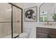 Modern bathroom with a glass-enclosed shower, sleek vanity, and stylish decor at 4775 Wyat Farm Overlook, Cumming, GA 30040