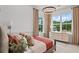 Cozy bedroom with large windows, modern lighting, and neutral tones creating a relaxing space at 4775 Wyat Farm Overlook, Cumming, GA 30040