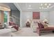 Elegant bedroom featuring ample natural light, seating area, and sophisticated accents at 4775 Wyat Farm Overlook, Cumming, GA 30040