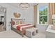 Bright bedroom featuring a large window, stylish decor, and modern furnishings at 4775 Wyat Farm Overlook, Cumming, GA 30040