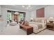 Elegant bedroom featuring ample natural light, seating area, and sophisticated accents at 4775 Wyat Farm Overlook, Cumming, GA 30040